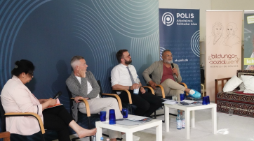 Das Podium bei der Veranstaltung